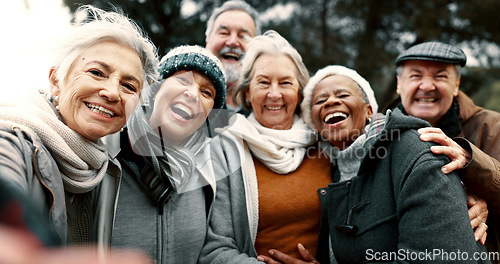 Image of Happy, selfie and senior friends in a park while walking outdoor for fresh air together. Diversity, smile and group of elderly people in retirement taking picture and bonding in a forest in winter.