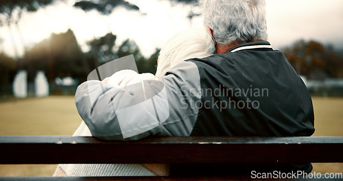 Image of Hug, senior couple and bench with back for retirement or to relax with care or quality time. Happy face, nature and elderly woman or man with support or embrace for love, trust in garden together.