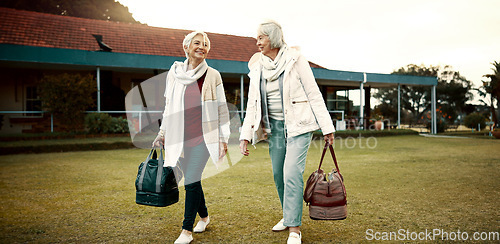 Image of Retirement, hobby and senior woman friends walking on a field at the bowls club together for a leisure activity. Smile, talking and elderly people on the green of a course for bonding or recreation