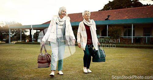 Image of Retirement, hobby and senior woman friends walking on a field at the bowls club together for a leisure activity. Smile, talking and elderly people on the green of a course for bonding or recreation
