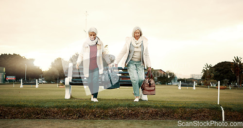 Image of Retirement, hobby and senior woman friends walking on a field at the bowls club together for a leisure activity. Smile, talking and elderly people on the green of a course for bonding or recreation