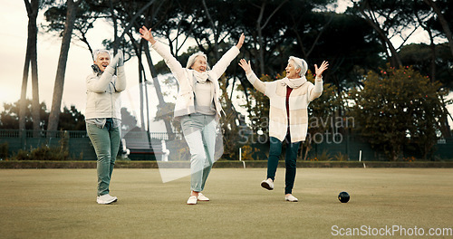 Image of Senior women, celebration and park for sport, lawn bowling and happy for fitness, goal or applause in nature. Teamwork, elderly lady friends and metal ball for games, contest or win together on grass