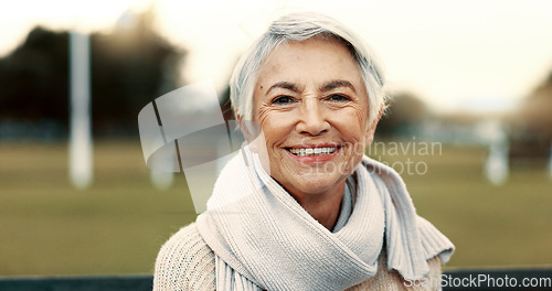 Image of Face, elderly woman and happy on park bench on vacation, holiday or travel in winter. Portrait, smile and senior person in nature, outdoor or garden for freedom to relax for retirement in Australia