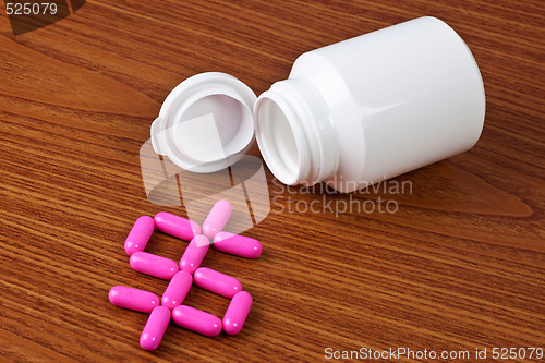 Image of Medicine capsules forming a dollar sign