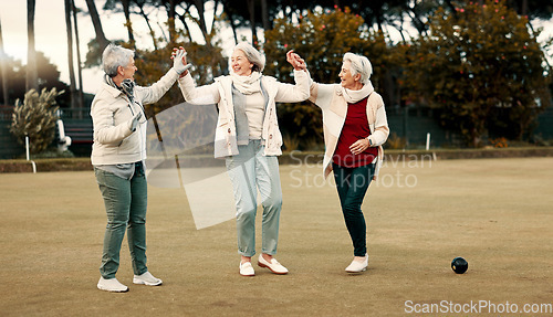 Image of Senior women, celebration and park for sport, lawn bowling and happy for fitness, goal or applause in nature. Teamwork, elderly lady friends and metal ball for games, contest or win together on grass