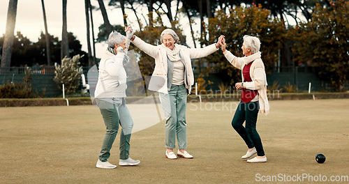 Image of Senior women, celebration and park for sport, lawn bowling and happy for fitness, goal or applause in nature. Teamwork, elderly lady friends and metal ball for games, contest or win together on grass