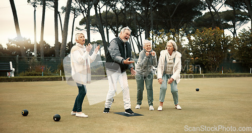Image of Senior man, team and bowling on grass with miss, fail or support for fitness, sport or game in retirement. Teamwork, group and elderly women with metal ball, exercise or kindness for training on lawn