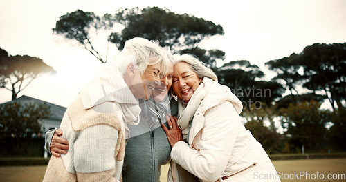 Image of Talking, laughing and elderly woman friends outdoor in a park together for bonding during retirement. Happy, smile and funny with a group of senior people hugging in a garden for humor or fun