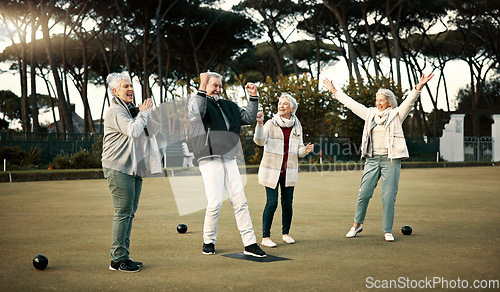 Image of Bowls, high five and celebration with senior friends outdoor, cheering together during a game. Motivation, support or applause and a group of elderly people cheering while having fun with a hobby