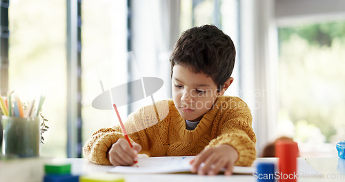 Image of Student, drawing or boy writing homework on notebook in kindergarten education for growth development. Project, creative or young kid artist with color pencil learning or working on sketching skills