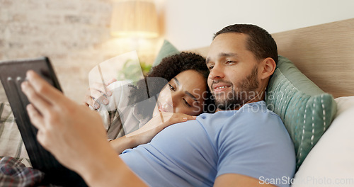 Image of Couple, tablet and scroll in bed, morning and bond with internet video, movie and meme for love, care and hug. Man, woman and digital touchscreen for typing, social network app or web blog in house