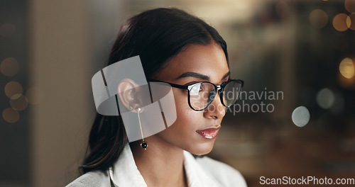 Image of Internet, reflection and woman in office with glasses, overtime at computer with planning and thinking. Vision, research and businesswoman typing email, late at night work on future ideas for agency.