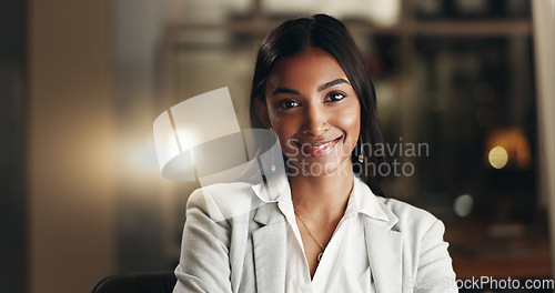 Image of Happy, night and face of professional woman, office consultant or lawyer happy for overtime work, commitment or career. Pride, corporate portrait and Indian person working late in company law firm