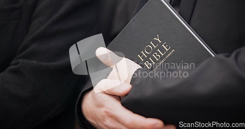 Image of Bible, funeral and hands closeup of a priest for religion, sad and mourning event in church. Faith, male person and spiritual passage with worship and book for grief with support and condolences