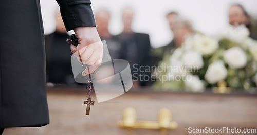 Image of Funeral, religion and hands with rosary for memorial service, death ceremony and obituary sermon. Christianity, burial and closeup of pastor or priest with religious symbol for gospel, faith and loss