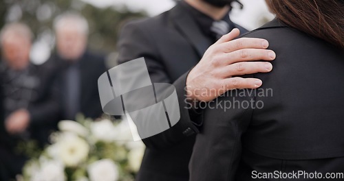 Image of Funeral, support and people care for grief, mourning or depressed mother at burial ceremony, memorial service or cemetery. Hand, shoulder and man helping sad woman with love, advice or family comfort