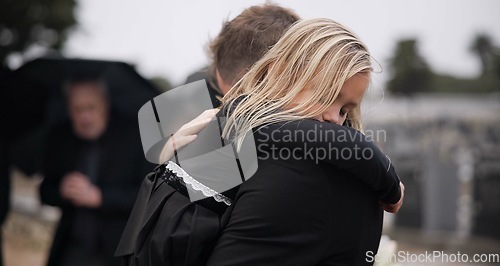Image of Sad, death and a girl with her father at a funeral for grief or mourning loss together outdoor. Family, empathy and a man holding his daughter at a memorial service or ceremony for condolences