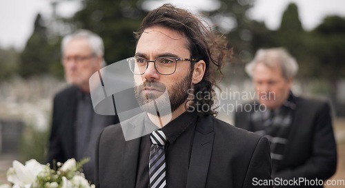 Image of Funeral, death and man carry coffin with family in grief, mourning and sad during church service for peace. Memorial, difficult and person with loss walking in the wind with casket in a ceremony