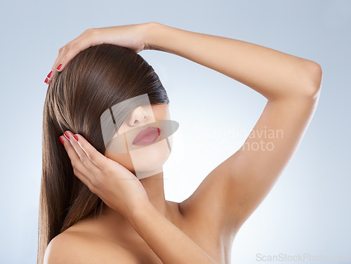 Image of Face, beauty and hair of woman at salon in studio on white background for keratin treatment. Hands, nails and manicure with confident young haircare model for shampoo, cosmetics or hairdressing