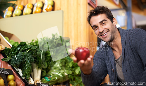 Image of Apple, portrait or happy man shopping at a supermarket for grocery promotions, sale or discounts deal. Smile, offer or customer buying groceries for healthy nutrition, organic fruits or diet choice