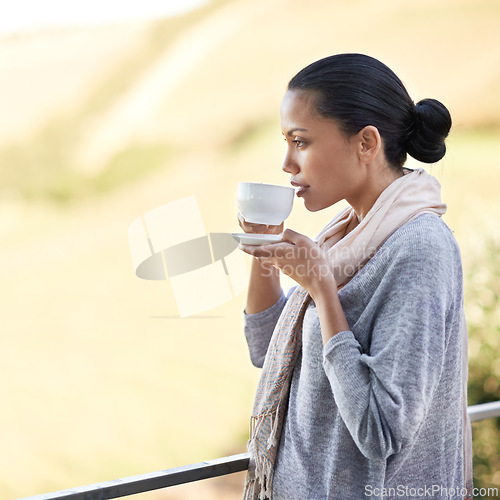 Image of Woman, drink coffee on balcony and outdoor to relax with warm beverage and morning routine for zen in nature. Peace, calm and espresso for caffeine, view and mockup space with tea cup in countryside