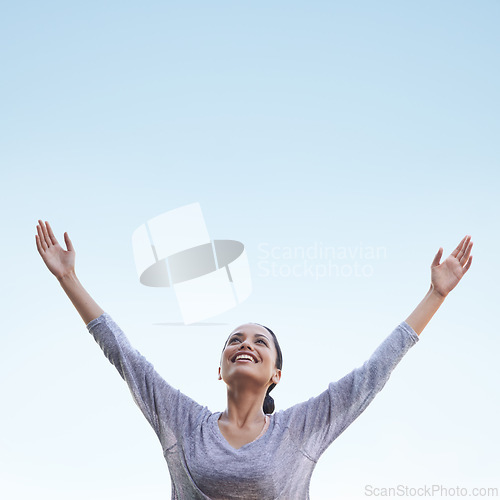 Image of Woman, arms up and blue sky with freedom and happiness outdoor, health and wellness, stress relief and gratitude, Celebration, joy and smile on face in nature with mockup space, praise and thanks