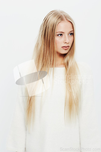 Image of Woman, natural and beauty in haircare, cosmetics or makeup on a white studio background. Face of young female person, blonde or attractive model with long healthy hairstyle, glow or shine on mockup