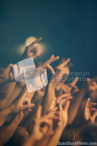 Image of Rock concert, hands and music festival with people, event and party with fun and entertainment. Freedom, energy or crowd screaming with excitement and social with audience or group with performance
