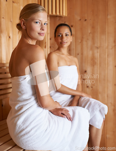 Image of Sauna, spa and portrait of women to relax for beauty, detox or sweat for skincare wellness. Luxury, treatment and friends sitting together in steam room for facial, anti aging and benefits to body