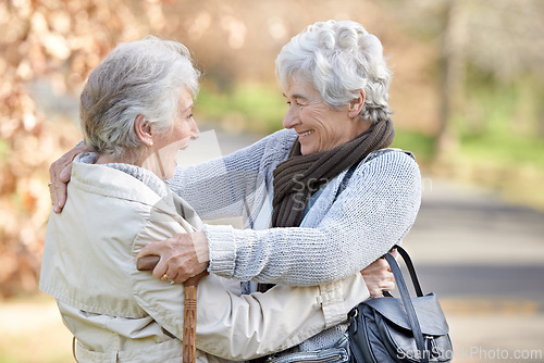 Image of Nature, excited and senior women hugging for support, bonding or care in outdoor park or garden. Happy, smile and elderly friends in retirement embracing for greeting, connection or trust in field.