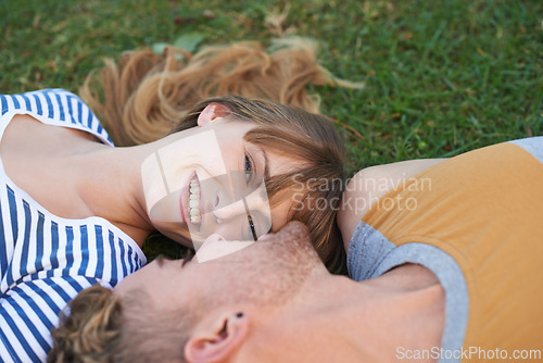 Image of Grass field, love and portrait of happy woman, couple or people relax for outdoor sunshine, wellness or romantic date. Smile, commitment and face of woman lying with partner on pitch, garden or lawn