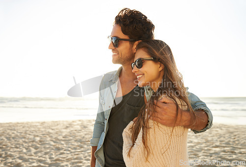 Image of Travel, hug and happy couple at a beach with love, adventure and bonding in nature together. Profile, freedom and people embrace at the sea for ocean view, summer and romance on Miami vacation trip