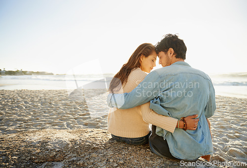 Image of Beach sunset, hug and relax couple with love, support and relationship security on summer holiday in Portugal. Mockup space, forehead touch and back of partner, soulmate or people embrace on date