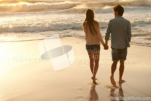 Image of Beach sunset, love and couple holding hands on walk, sand journey or travel holiday for outdoor wellness in Peru. Mockup space, sea waves and back of man, woman or people on romantic tropical island