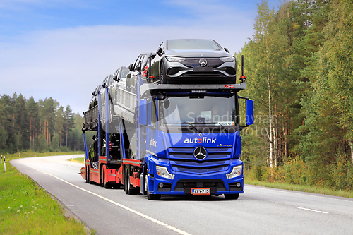 Image of Blue Mercedes-Benz Car Carrier Truck Transports New Cars