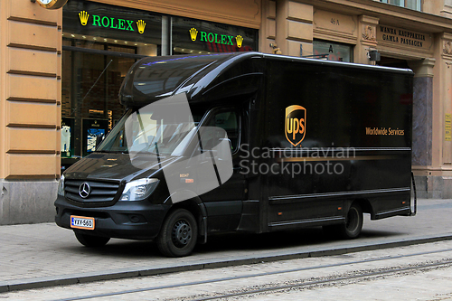 Image of UPS Delivery Truck Parked by Street