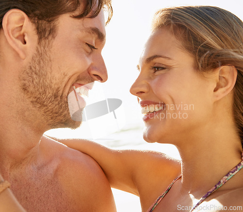 Image of Love, beach and happy couple hug outdoor with support, trust and care while bonding in nature together. Face, smile and people at sea with gratitude, fun or enjoying relationship, moment or romance