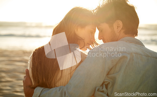 Image of Love, sunset and beach couple relax with summer sunshine, wellness and bonding on travel holiday in Greece. Forehead touch, romance and back of man, woman or people connect with devotion to soulmate