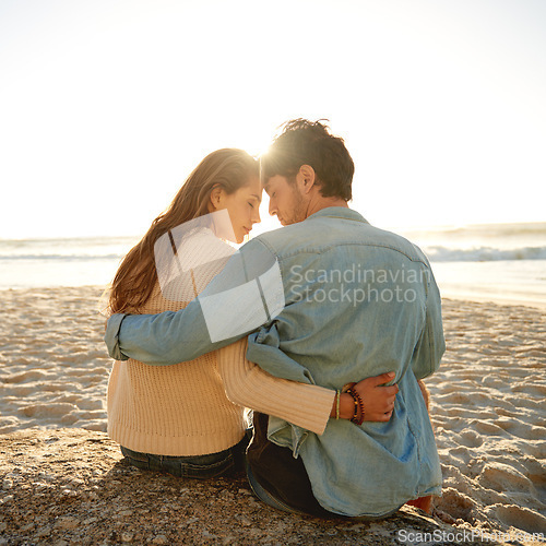 Image of Beach sunset, hug and couple relax with love, support and relationship security on summer holiday in Greece. Embrace, forehead touch and back of marriage partner, soulmate or people bonding on date