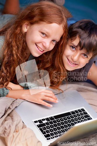 Image of Children, relax and portrait with laptop on floor together with happiness and online games for holiday or vacation. Kids, smile and playing with computer on website, streaming or search on internet