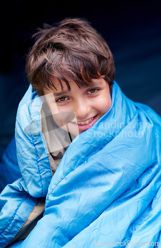 Image of Travel, camping and portrait of child in sleeping bag for resting, relax and comfortable in tent gear. Happy, youth and boy in sleep sack for adventure on holiday, vacation and weekend outdoors