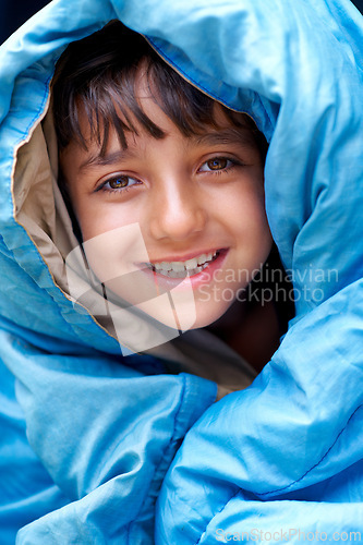 Image of Boy, child and tent portrait for camping, relax and happy summer vacation in outdoor travel. Young camper, smile and wrapped in sleeping bag, adventure or nature with recreation for childhood