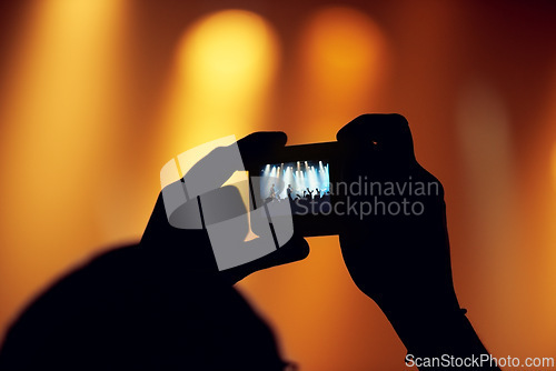 Image of Hands, cellphone or image of band at concert, music event or audience with flashlight in bokeh. Person, photography or graphic on smartphone, technology or celebration with crowd at disco performance