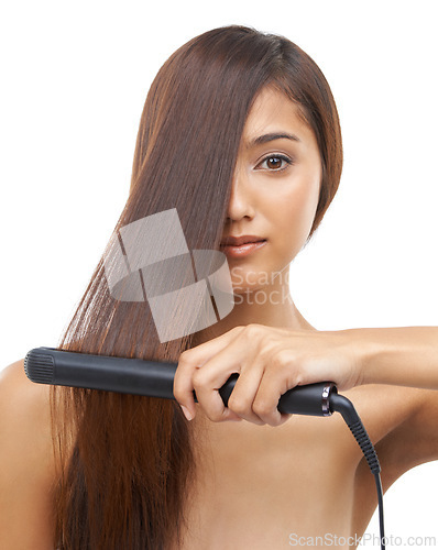 Image of Hair care, straightener and portrait of woman in studio for cosmetic, salon and beauty treatment. Flat iron tool, confident and young female person with healthy hairstyle routine by white background.