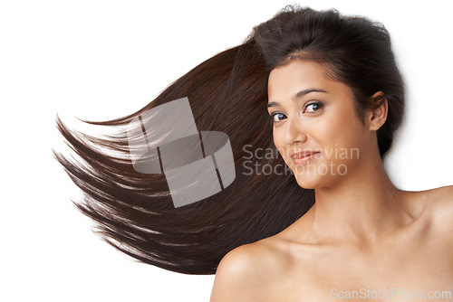 Image of Hair care, woman and portrait or wind in studio with keratin treatment, soft texture and shampoo or collagen shine . Model, face and beauty with hairstyle, cosmetics and happy on white background