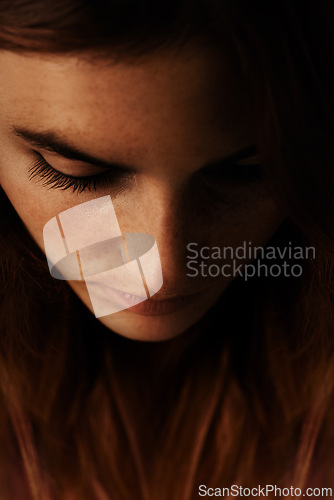 Image of Woman, beauty and thinking face with salon, lash extension and makeup with treatment in studio. Closeup, cosmetics and female person with mascara, eyelash lift with freckles and dark background