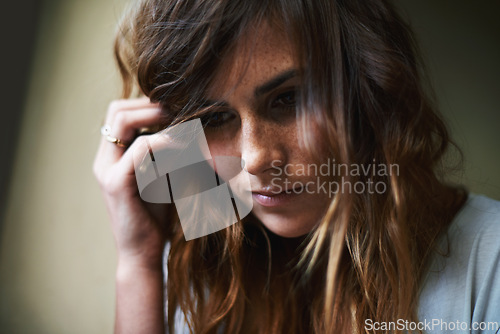 Image of Woman, face and thinking with headache in mistake, stress or burnout on wall background at home. Closeup of young female person in mental health, anxiety or depression with insomnia in lonely house