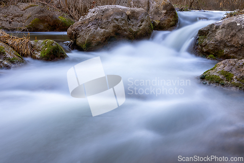 Image of mountain stream flowing thorugh the rocks