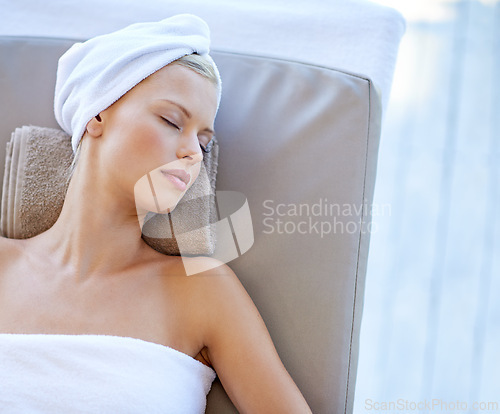 Image of Young woman, relax and rest in spa for health, wellness and peace with body treatment in salon. Person, sleeping and zen on massage bed for physical therapy, detox and comfort at resort on holiday