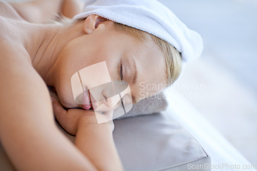 Image of Woman, relax and sleep on table in spa for skincare, beauty and luxury treatment for wellness with peace. Person, rest and lying on bed in hotel or salon for massage or dermatology care for body